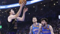 Los Angeles Lakers guard Austin Reaves (15) shoots as Oklahoma City Thunder center Chet Holmgren (7) and center Isaiah Hartenstein (55) look on during the first quarter at Paycom Center.