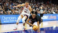 South Carolina Gamecocks forward Joyce Edwards (8) loses control of the ball against UConn Huskies guard Azzi Fudd (35) in the second half during a semifinal of the Final Four of the women's 2026 NCAA Tournament at Mortgage Matchup Center.