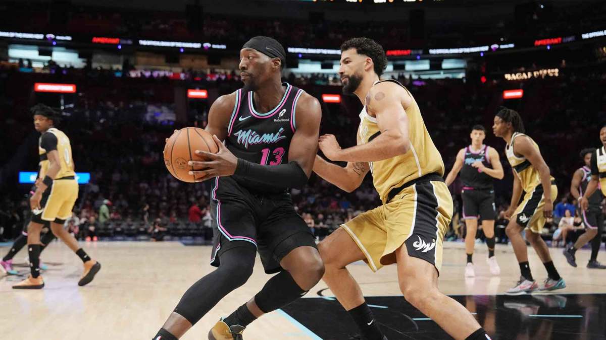 Miami Heat center Bam Adebayo (13) looks to pass the ball as Washington Wizards forward Anthony Gill (16) defends during the first half at Kaseya Center.