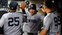 New York Yankees designated hitter Ben Rice (22) celebrates in the dugout after hitting a home run against the Seattle Mariners during the ninth inning at T-Mobile Park.