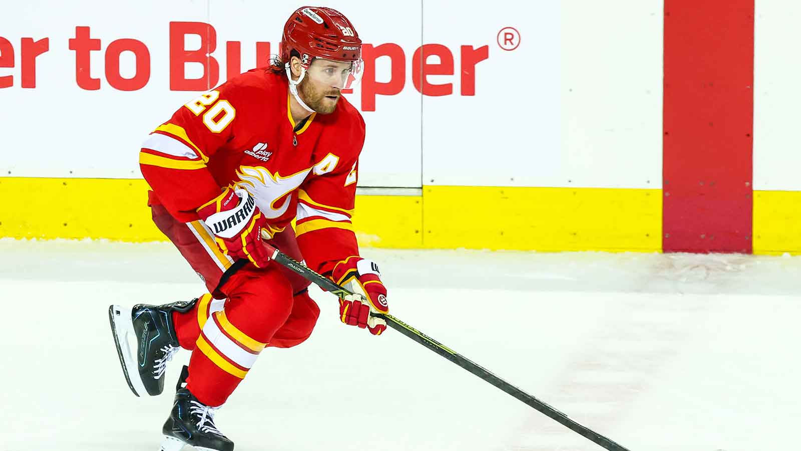 Calgary Flames left wing Blake Coleman (20) skates with the puck against the Utah Mammoth during the second period at Scotiabank Saddledome