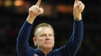 Illinois Fighting Illini head coach Brad Underwood reacts against the Connecticut Huskies in the second half during a semifinal of the Final Four of the men's 2026 NCAA Tournament at Lucas Oil Stadium.