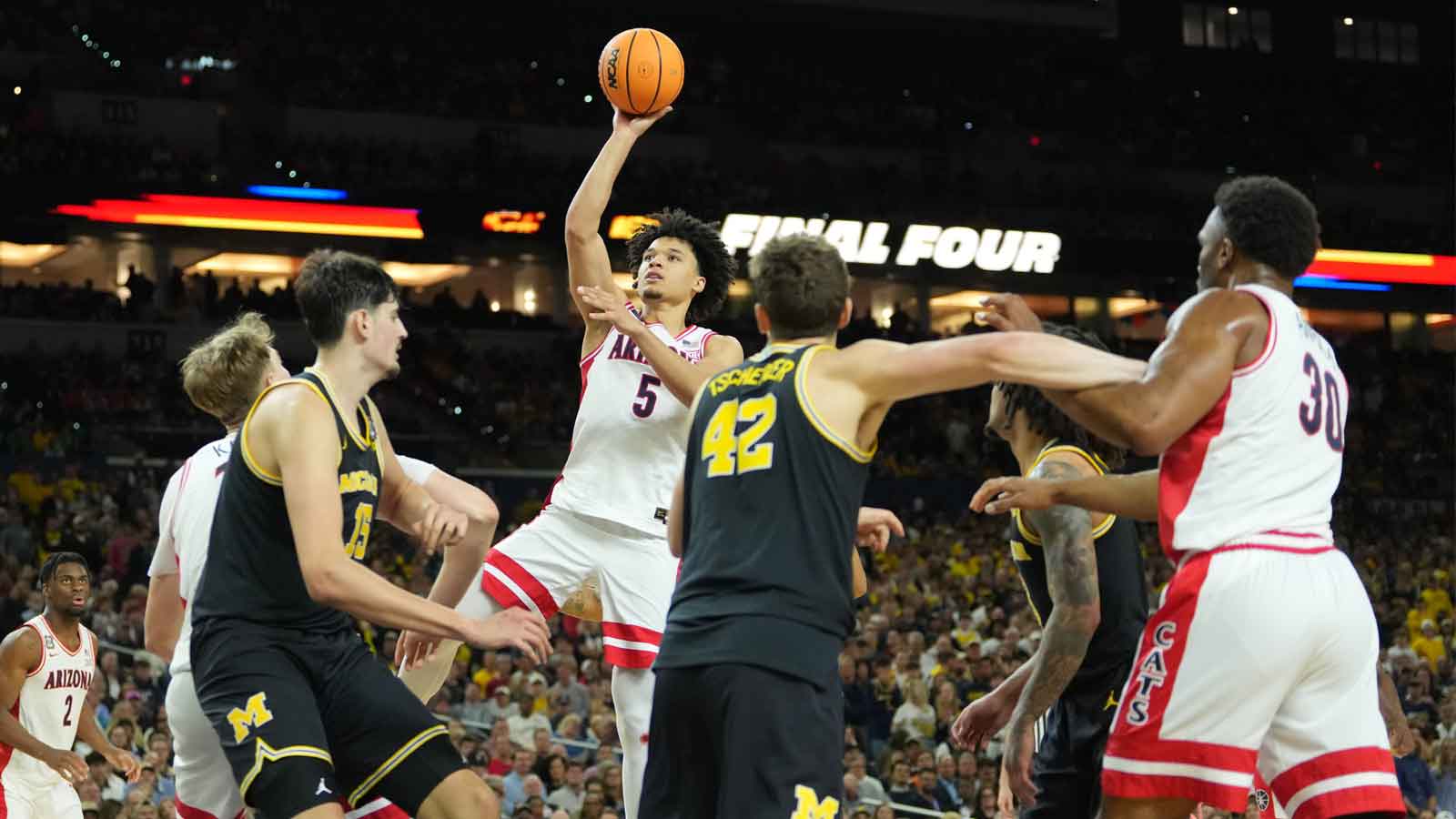 https://wp.clutchpoints.com/wp-content/uploads/2026/04/Brayden-Burries-shooting-over-Michigan.jpg