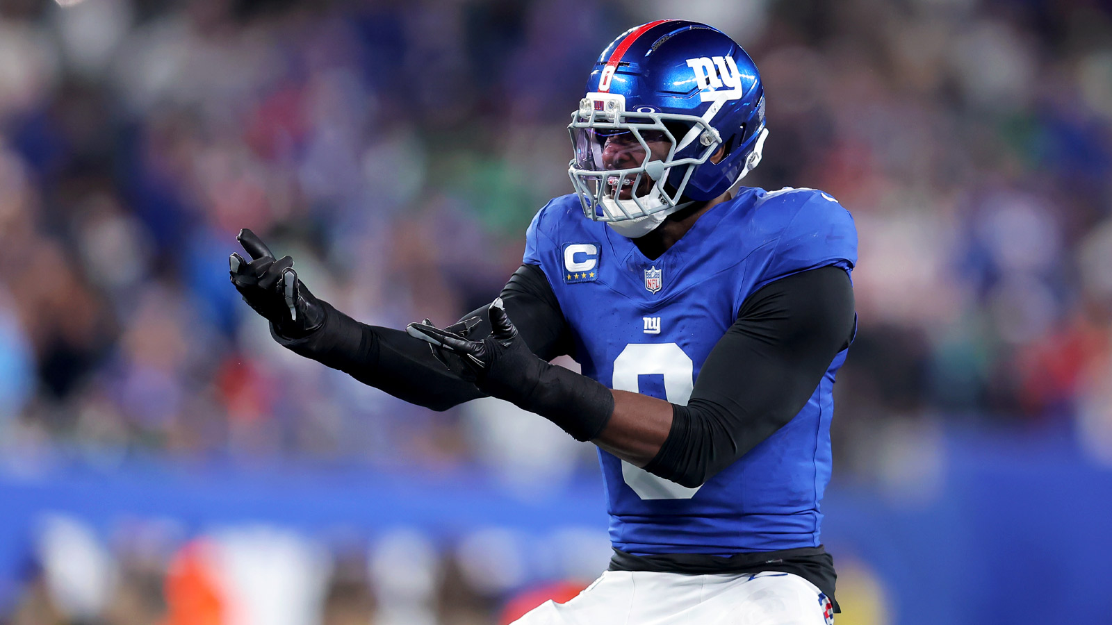New York Giants edge rusher Brian Burns doing Spider-Man celebration after a sack.