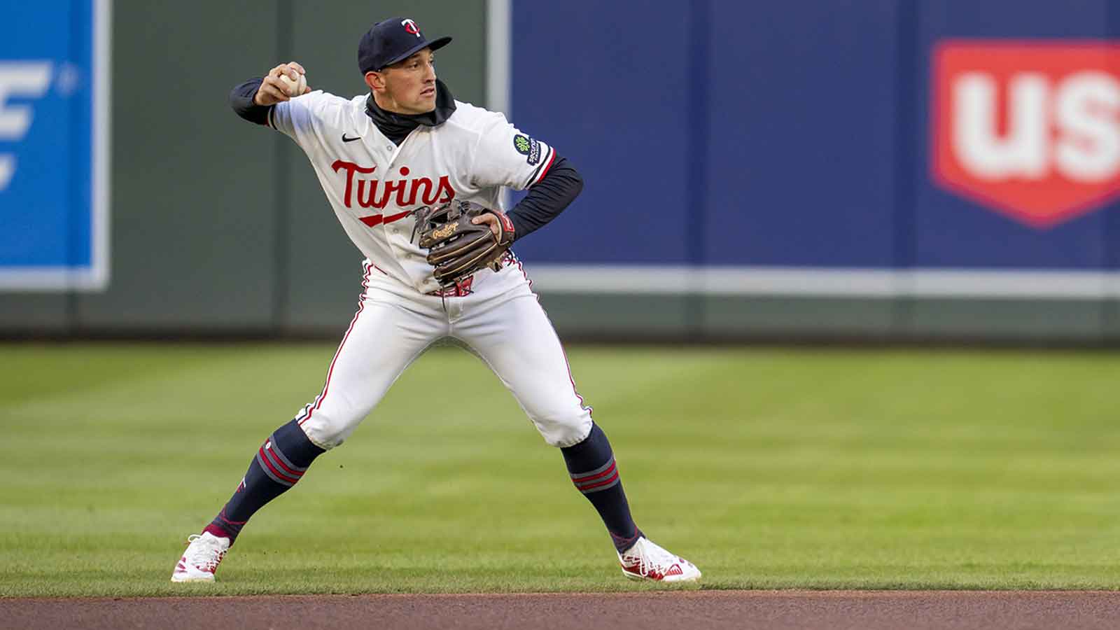 Minnesota Twins shortstop Brooks Lee (22) throws the ball to first base for an out against the Detroit Tigers in the first inning at Target Field