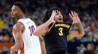 Michigan guard Elliot Cadeau (3) celebrates a play in the second half of their Final Four game against Arizona at Lucas Oil Stadium in Indianapolis on Saturday, April 4, 2026.