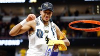Michigan Wolverines guard Elliot Cadeau (3) cuts the net after defeating Tennessee Volunteers in an Elite Eight game of the Midwest Regional of the men's 2026 NCAA Tournament at United Center.