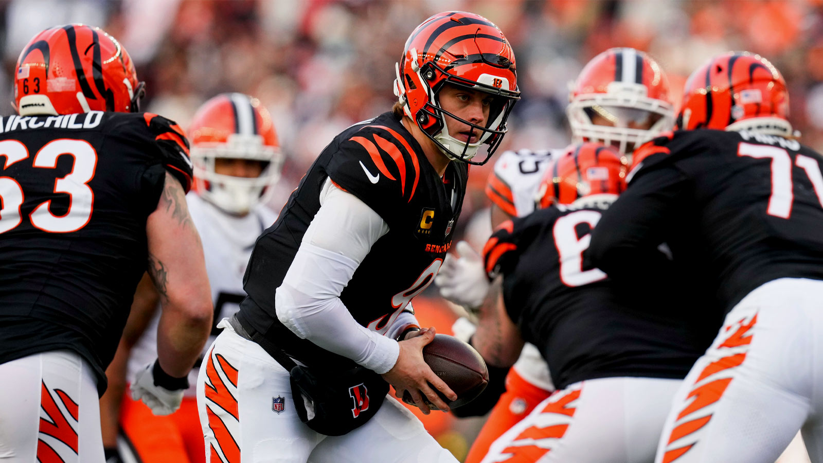 Cincinnati Bengals quarterback Joe Burrow (9) rolls back in the fourth quarter of the NFL Week 18 game between the Cincinnati Bengals and the Cleveland Browns at Paycor Stadium in Downtown Cincinnati on Sunday, Jan. 4, 2026. The Browns kicked a last second field goal to win 20-18.