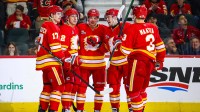 Calgary Flames center Ryan Strome (22) celebrates his goal with teammates against the Vancouver Canucks during the second period at Scotiabank Saddledome.
