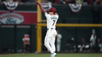 Arizona Diamondbacks Corbin Carroll (7) celebrates a 3-run home run against the Detroit Tigers at Chase Field.