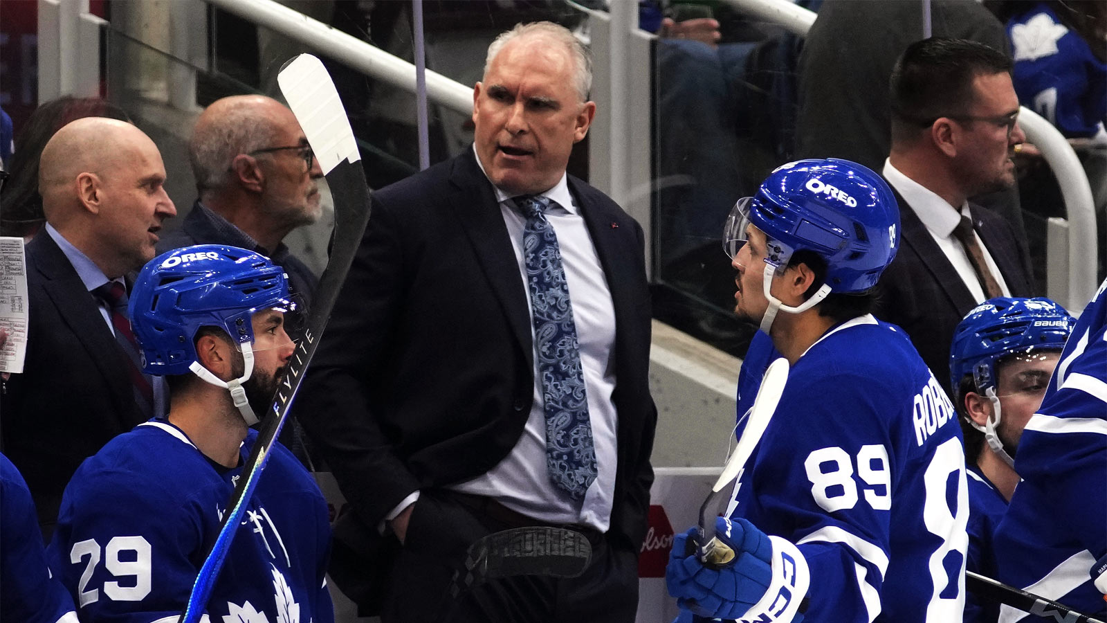 Toronto Maple Leafs head coach Craig Berube talks forward Benoit-Olivier Groulx (29) and forward Nic Robertson (89) during a break in the action against the Anaheim Ducks during the third period at Scotiabank Arena. 