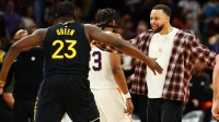 Golden State Warriors guard Stephen Curry celebrates with forward Draymond Green (23) against the Phoenix Suns in the second half at Mortgage Matchup Center.