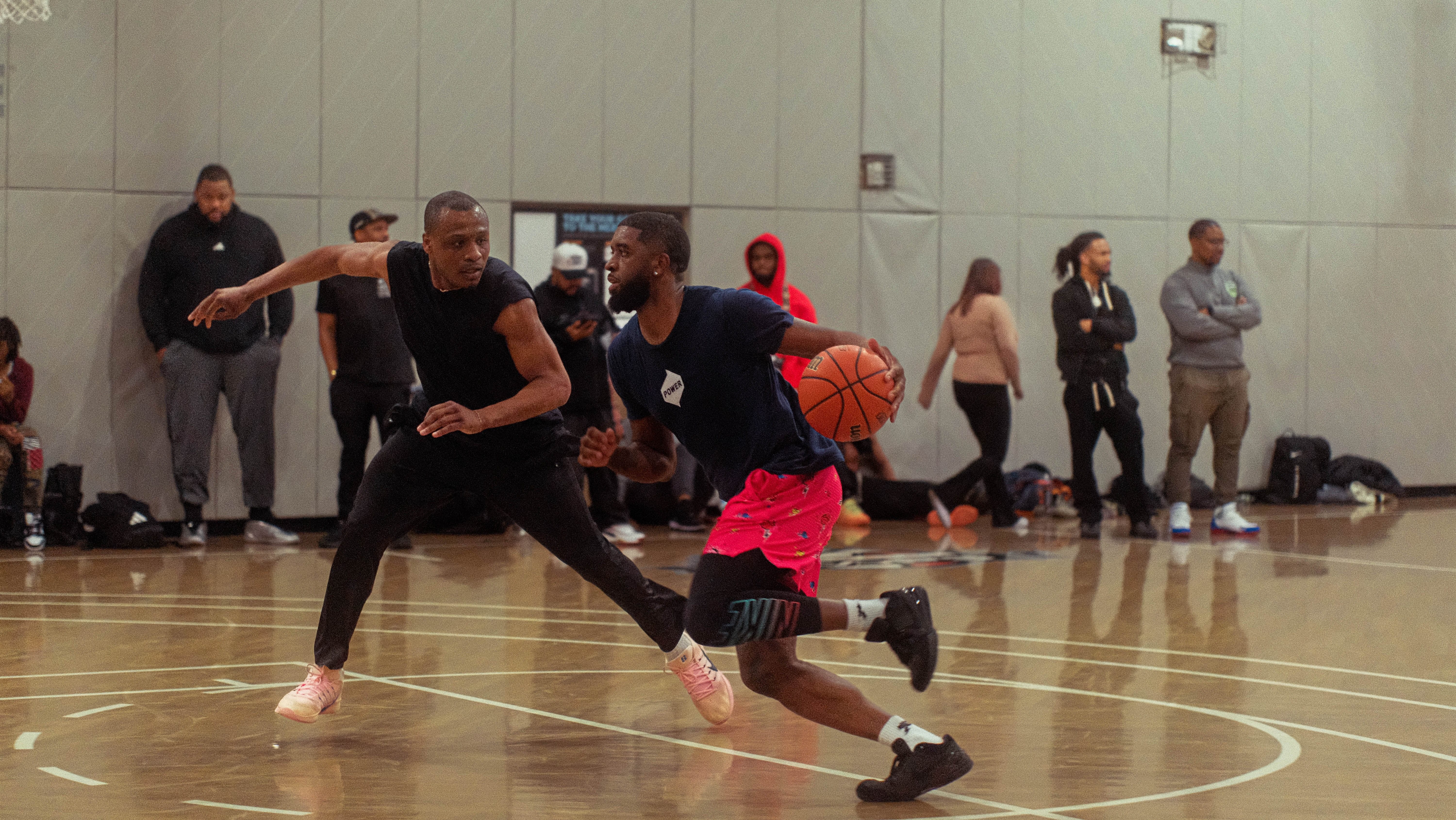two men playing one-on-one basketball against each other at OBL tryouts in New York