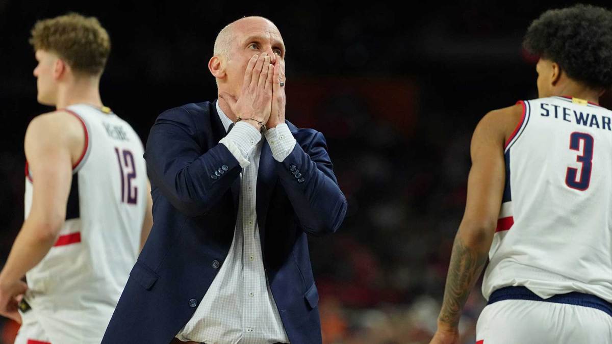 UConn Huskies head coach Dan Hurley reacts after a play against the Illinois Fighting Illini during the second half of a semifinal of the Final Four of the men's 2026 NCAA Tournament at Lucas Oil Stadium.