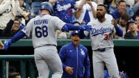 Los Angeles Dodgers catcher Dalton Rushing (68) is hit with sunflower seeds at the Dodgers' dugout step after hitting a two run hoe run against the Washington Nationals during the sixth inning at Nationals Park.