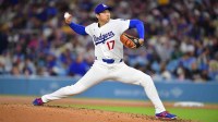 Los Angeles Dodgers two-way player Shohei Ohtani (17) throws to the plate during the third inning against the Cleveland Guardians at Dodger Stadium.