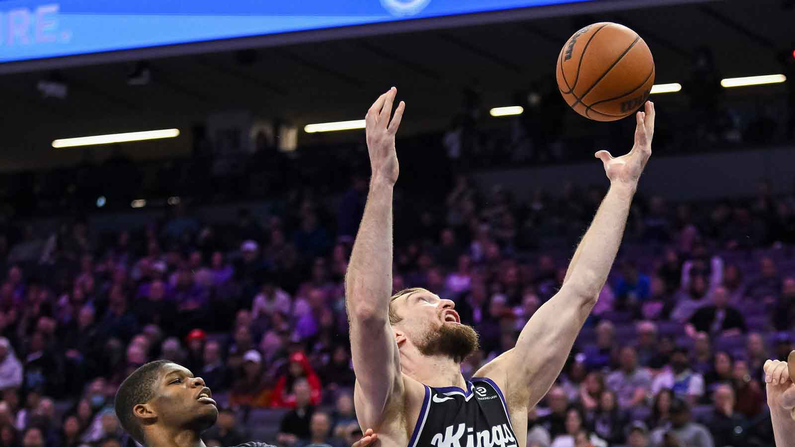 Sacramento Kings forward/center Domantas Sabonis (11) rebounds against Memphis Grizzlies guard Cedric Coward (23) during the third quarter at Golden 1 Center.