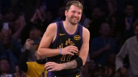 Los Angeles Lakers guard Luka Doncic (77) smiles after a dunk in the final minutes of the game against the Cleveland Cavaliers at Crypto.com Arena.