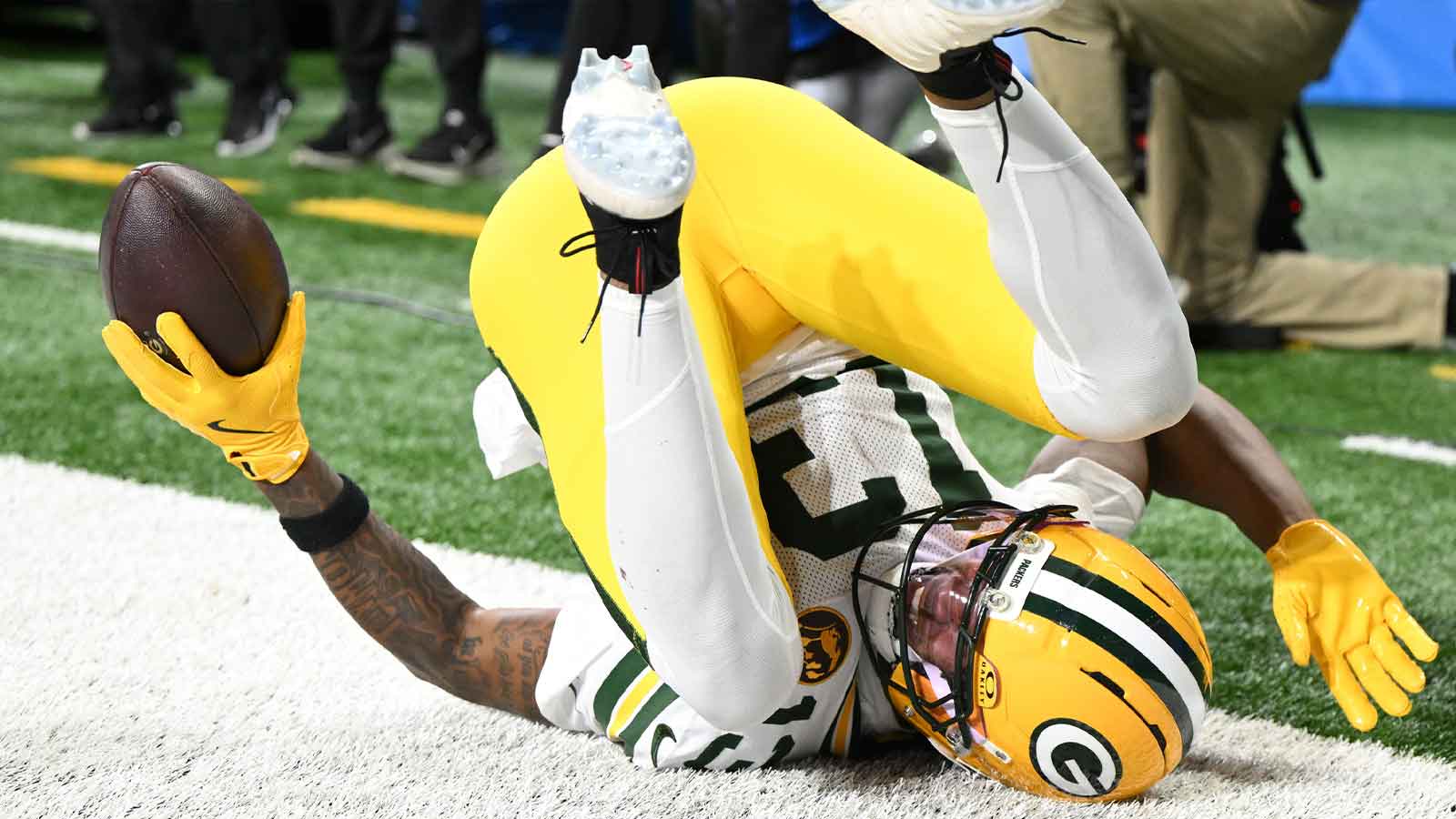 Green Bay Packers wide receiver Dontayvion Wicks (13) catches a pass for a touchdown against the Detroit Lions during the second quarter at Ford Field.