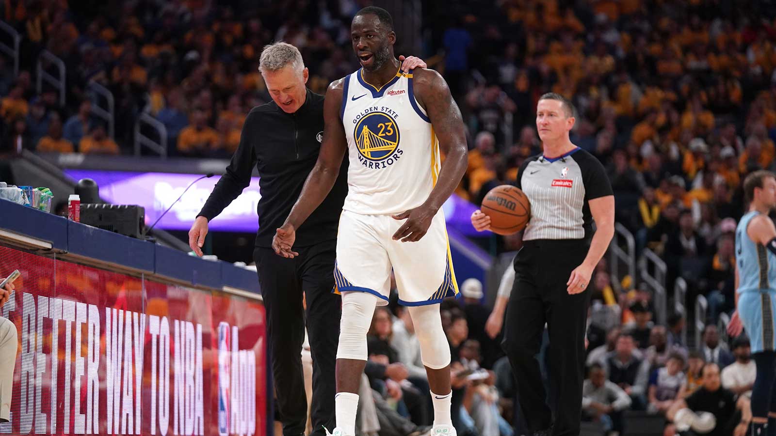 Warriors forward Draymond Green (23) walks towards the team bench with head coach Steve Kerr after a play against the Memphis Grizzlies in the third quarter at the Chase Center