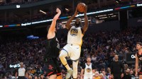 Golden State Warriors forward Draymond Green (23) drives to the hoop next to Houston Rockets center Alperen Sengun (28) in the second quarter at the Chase Center.