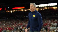 Michigan Wolverines head coach Dusty May reacts during the second half in a semifinal of the Final Four of the men's 2026 NCAA Tournament at Lucas Oil Stadium.