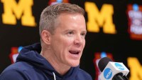 Michigan head coach Dusty May during a press conference ahead of the Final Four of the men's 2026 NCAA Tournament at Lucas Oil Stadium.