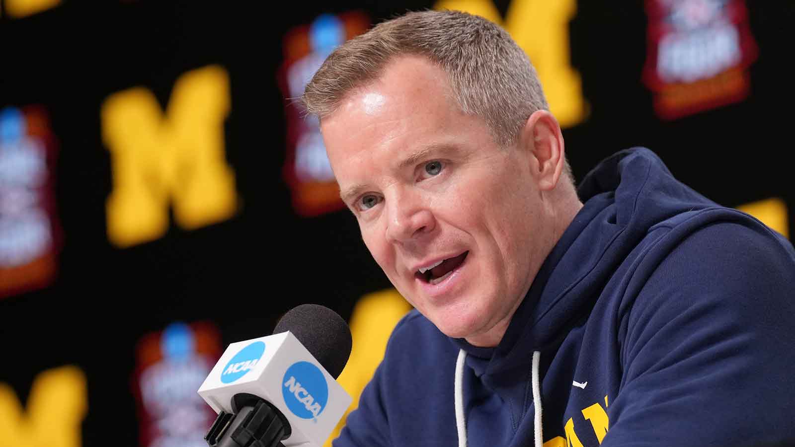 Michigan head coach Dusty May during a press conference ahead of the Final Four of the men's 2026 NCAA Tournament at Lucas Oil Stadium.