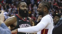 Feb 28, 2019; Houston, TX, USA; Houston Rockets guard James Harden (13) and Miami Heat guard Dwyane Wade (3) talk on the court after the game at Toyota Center. Mandatory Credit: Troy Taormina-Imagn Images
