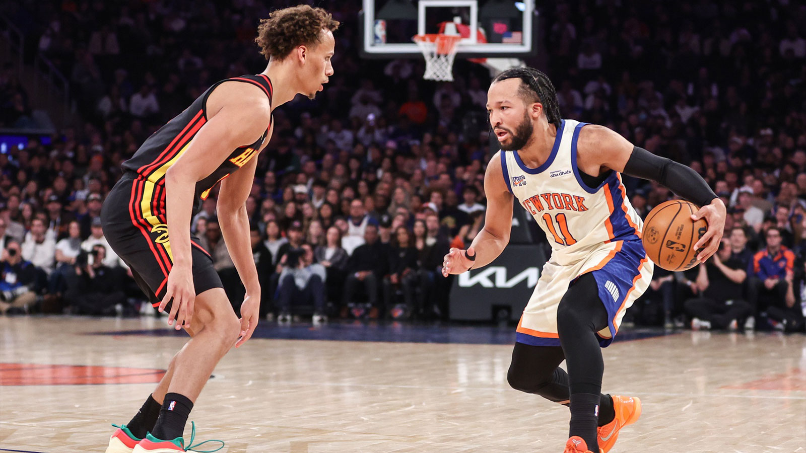 New York Knicks guard Jalen Brunson (11) looks to drive past Atlanta Hawks guard Dyson Daniels (5) in the second quarter at Madison Square Garden.