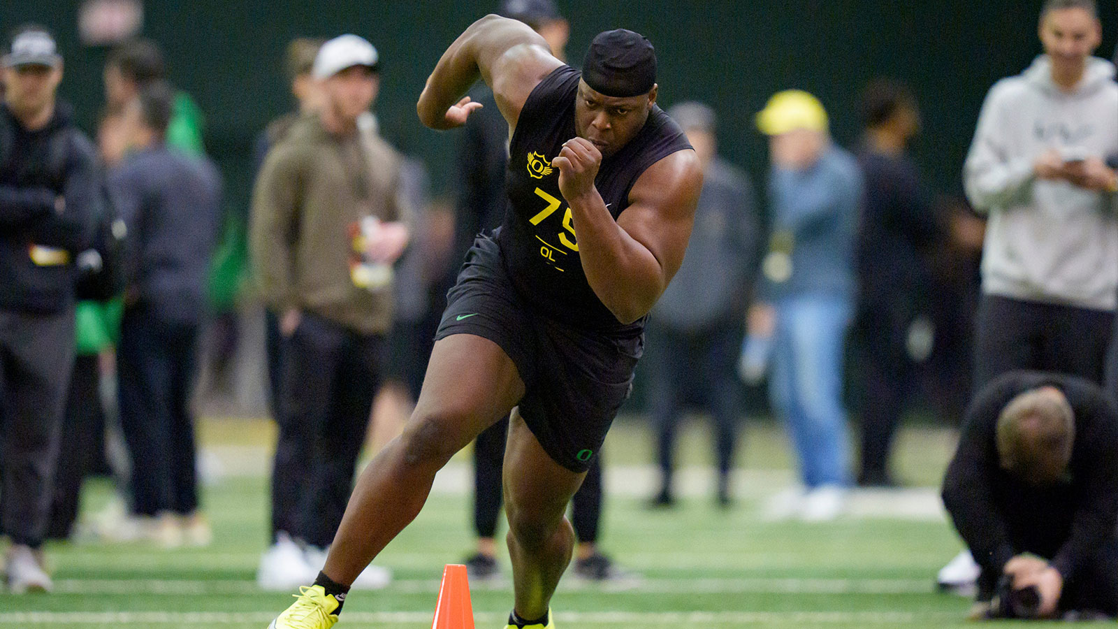 Oregon offensive lineman Emmanuel Pregnon runs drills during Oregon Pro Day on March 17, 2026, at the Moshofsky Center in Eugene, Oregon.