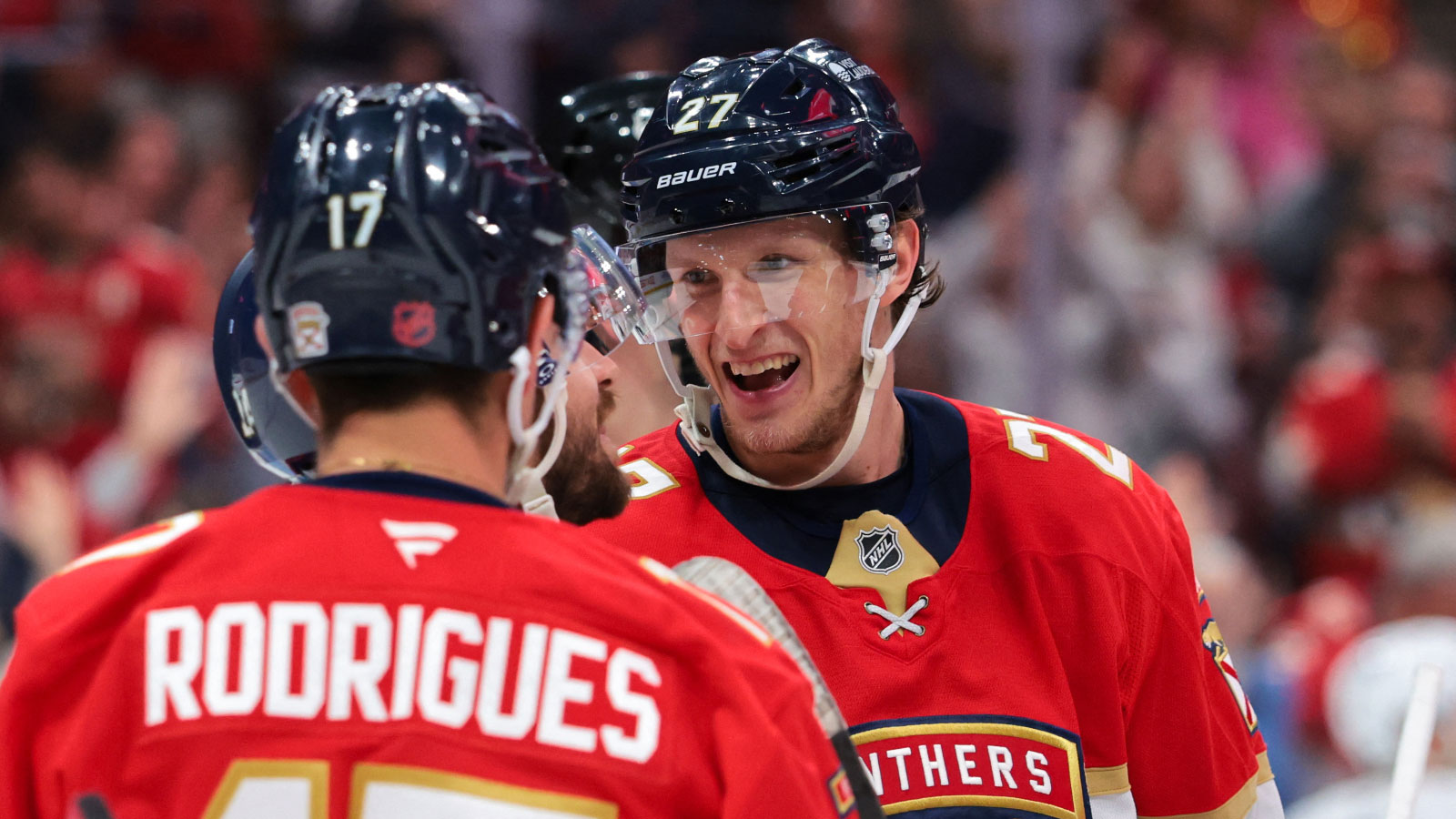 Florida Panthers center Eetu Luostarinen (27) celebrates with center Evan Rodrigues (17) and center Vinnie Hinostroza (24) after scoring against the Seattle Kraken during the third period at Amerant Bank Arena. 