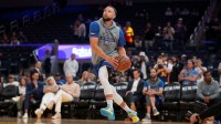 Golden State Warriors guard Stephen Curry (30) warms up before the start of the game against the Houston Rockets at the Chase Center.