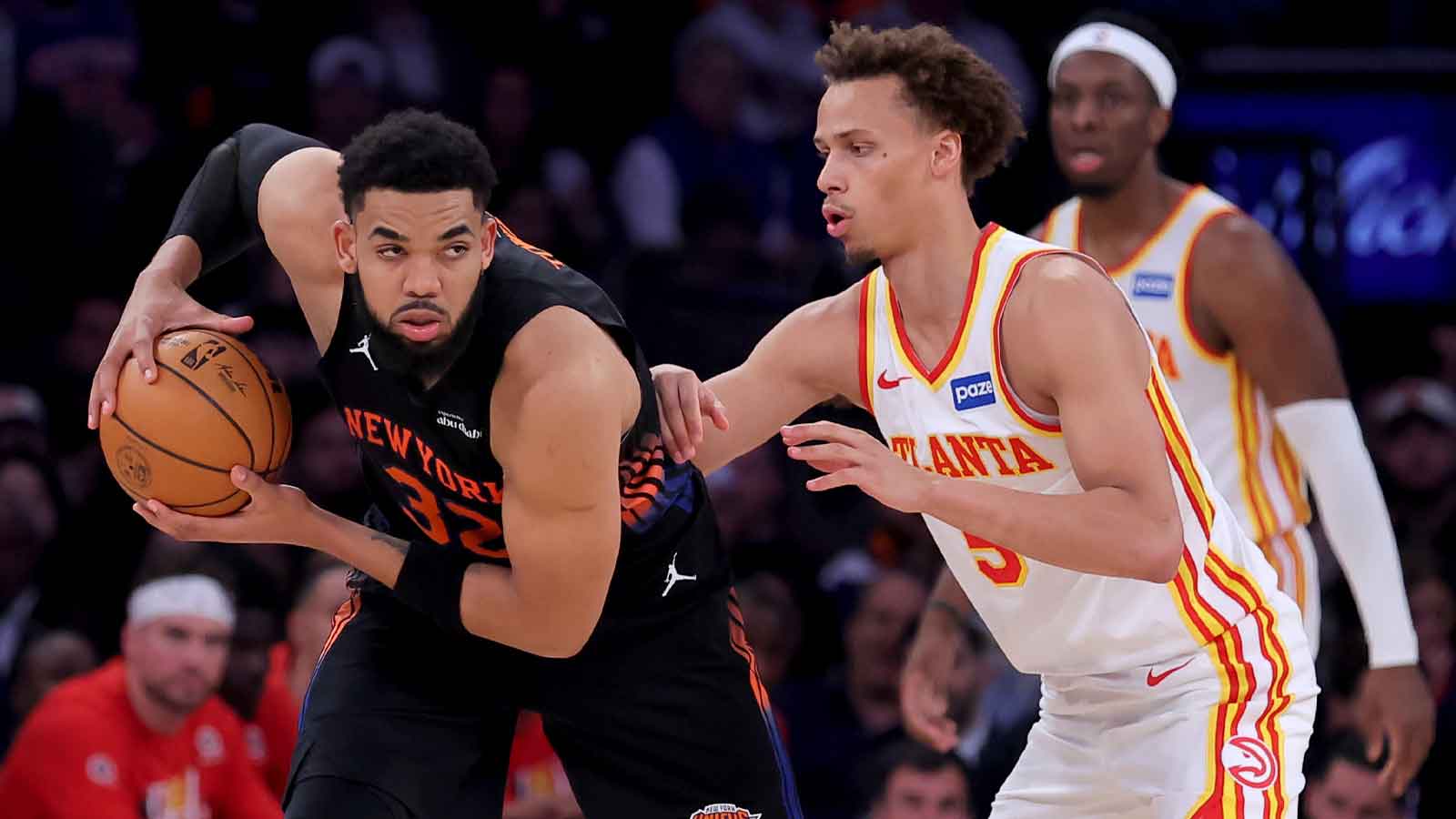 New York Knicks center Karl-Anthony Towns (32) controls the ball against Atlanta Hawks guard Dyson Daniels (5) during the third quarter of game five of the first round of the 2026 NBA Playoffs at Madison Square Garden.