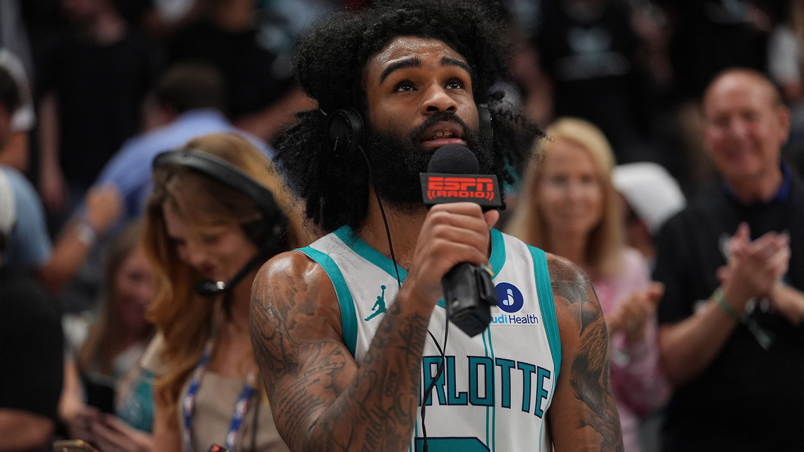 Hornets guard Coby White (3) gives an interview after the overtime win during the play-in rounds between the Charlotte Hornets and the Miami Heat of the 2026 NBA Playoffs at Spectrum Center