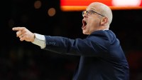 UConn Huskies head coach Dan Hurley reacts after a play against the Illinois Fighting Illini during the first half of a semifinal of the Final Four of the men's 2026 NCAA Tournament at Lucas Oil Stadium.