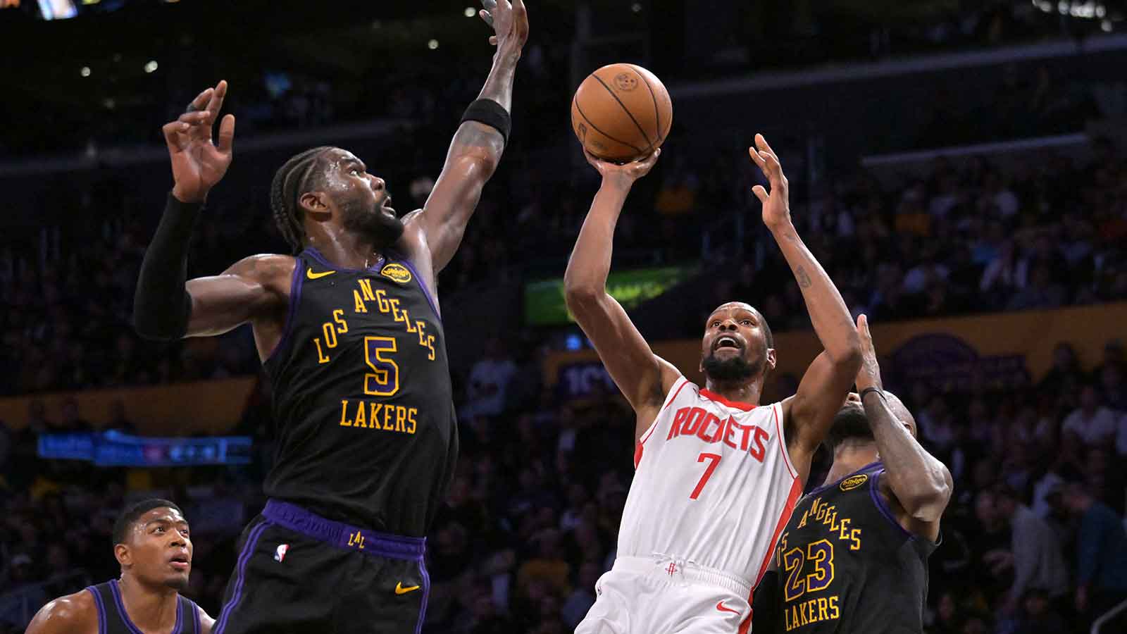 Houston Rockets forward Kevin Durant (7) is defended by Los Angeles Lakers center Deandre Ayton (5) as he drives to the basket during the second half of game two of the first round of the 2026 NBA Playoffs at Crypto.com Arena.