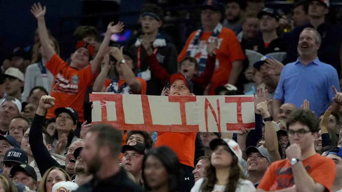 A young fan holds up a Illinois Fighting Illini sign Saturday, April 4, 2026, during a Final Four game against the UConn Huskies at Lucas Oil Stadium in Indianapolis.