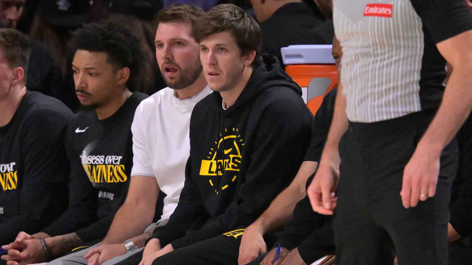 Los Angeles Lakers guard Luka Doncic (77) and guard Austin Reaves (15) look on from the bench in the first half of game two of the first round of the 2026 NBA Playoffs against the Houston Rockets at Crypto.com Arena.