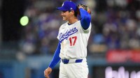 Los Angeles Dodgers pitcher Shohei Ohtani (17) reacts after hitting Cleveland Guardians center fielder Angel Martinez (1) with a pitch during the fifth inning at Dodger Stadium.