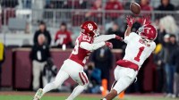Alabama's Isaiah Horton (1) makes a reception as OklahomaÕs Eli Bowen (23) defends in the second half of the College Football Playoff game between the University of Oklahoma Sooners (OU) and the Alabama Crimson Tide at the Gaylord Family - Oklahoma Memorial Stadium in Norman, Okla., Friday Dec. 19, 2025.