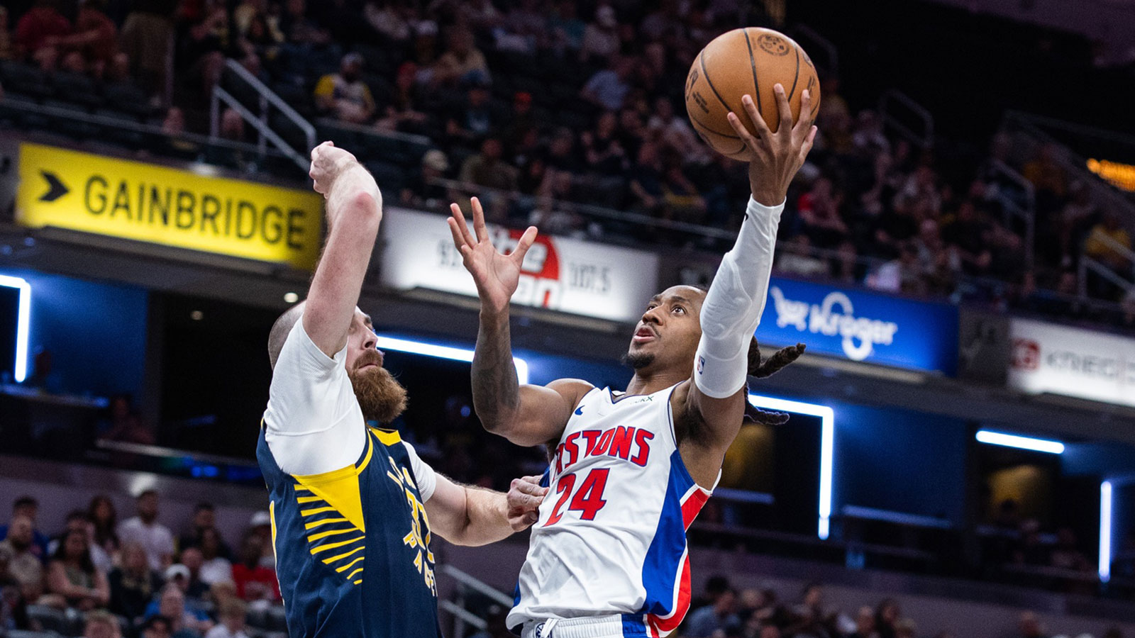 Indianapolis, Indiana, USA; Detroit Pistons guard Daniss Jenkins (24) shoots the ball while Indiana Pacers center Jay Huff (32) defends in the second half at Gainbridge Fieldhouse. 