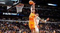 Tennessee guard Ja'Kobi Gillespie (0) dunks on Michigan forward Yaxel Lendeborg (23) during a NCAA Tournament Elite 8 game between Tennessee and Michigan at the United Center in Chicago on March 29, 2026.