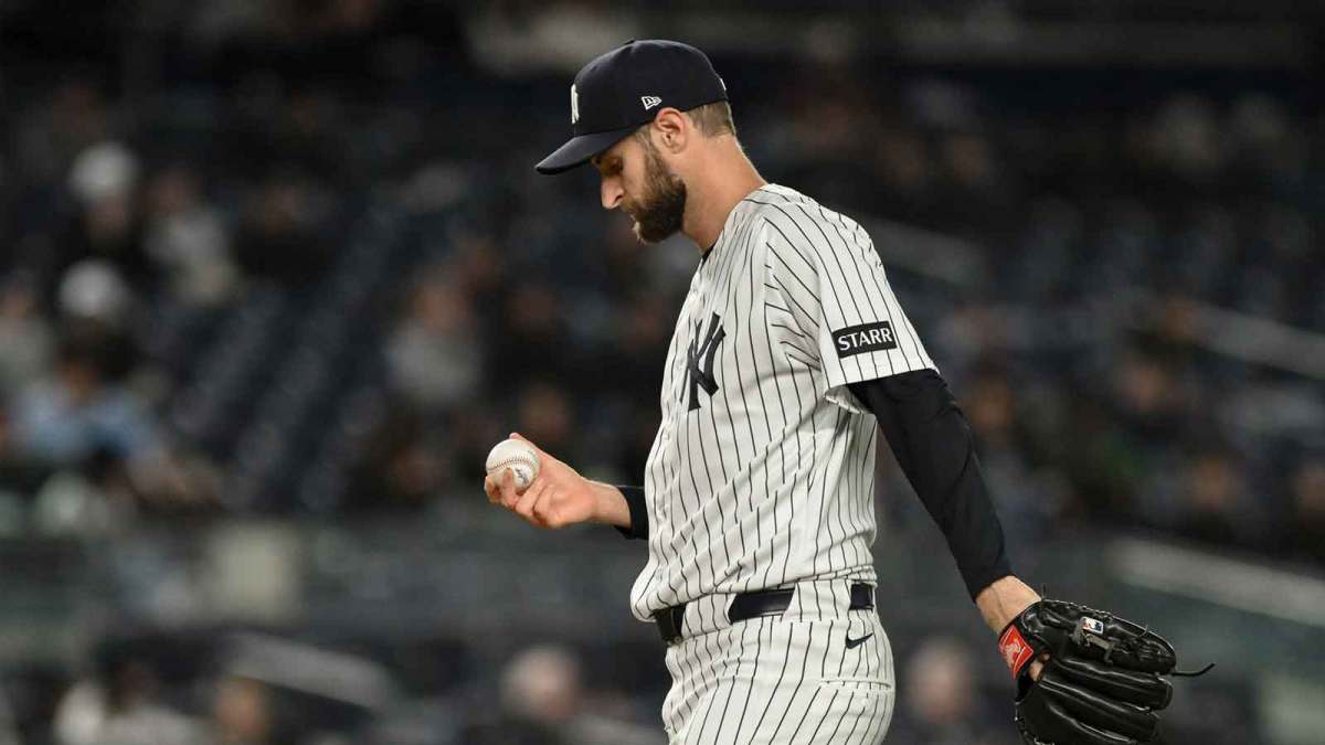 New York Yankees pitcher Jake Bird (59) reacts after surrendering consecutive walks to load the bases against the Miami Marlins during the eighth inning at Yankee Stadium