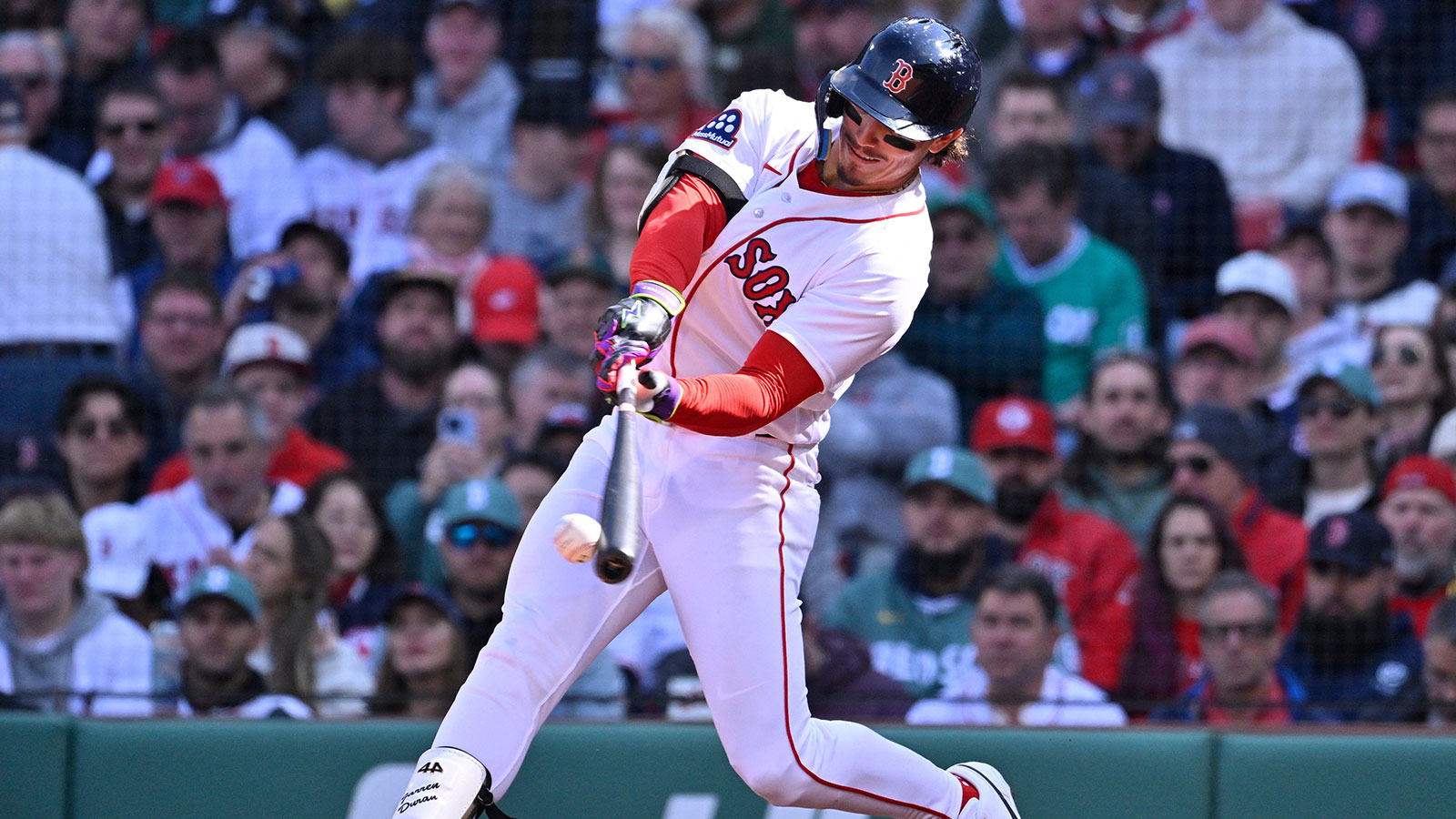 Boston Red Sox left fielder Jarren Duran (16) hits a double against the San Diego Padres during the fourth inning at Fenway Park.