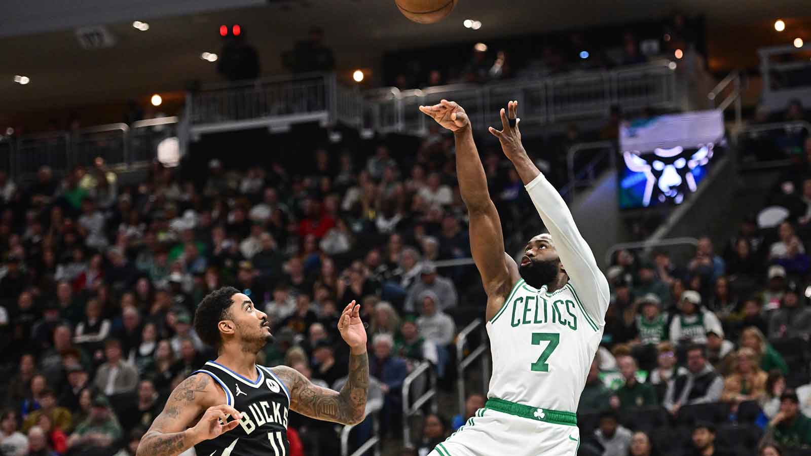 Boston Celtics forward Jaylen Brown (7) takes a shot against Milwaukee Bucks guard Gary Harris (11) in the third quarter at Fiserv Forum.