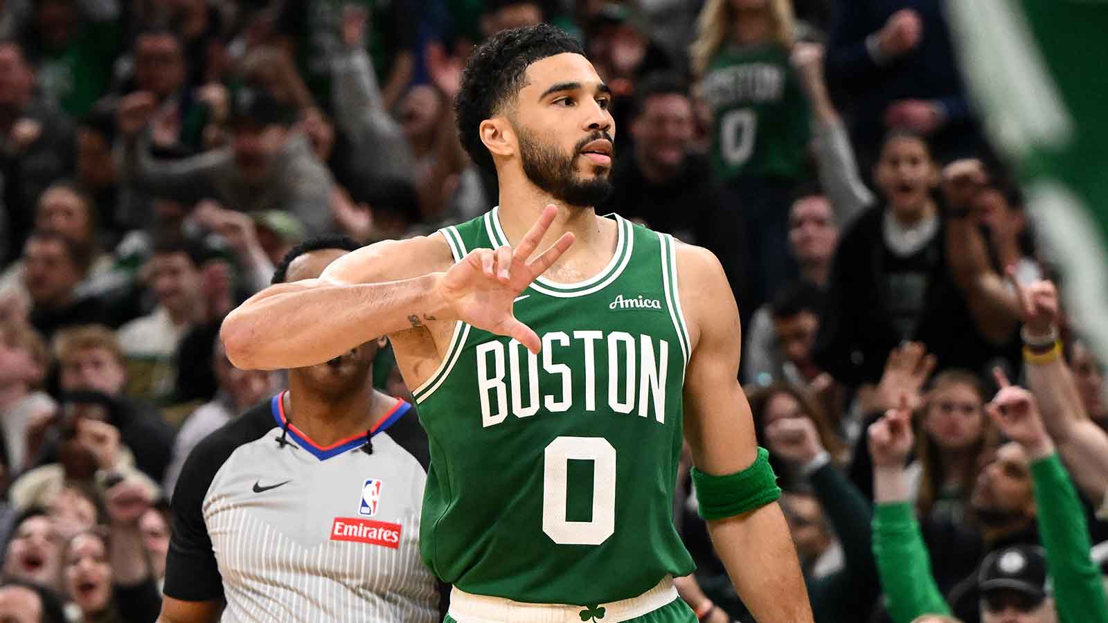 Boston Celtics forward Jayson Tatum (0) reacts after making a three-point basket against the Philadelphia 76ers in the second half of a game two of the first round of the 2026 NBA Playoffs at TD Garden.