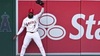 Los Angeles Angels right fielder Jo Adell (7) makes a catch against the Seattle Mariners during the first inning at Angel Stadium.