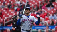 New York Mets left fielder Juan Soto (22) flips his bat after striking out against the St. Louis Cardinals during the fourth inning at Busch Stadium.