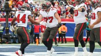 Nov 24, 2024; East Rutherford, New Jersey, USA; Tampa Bay Buccaneers running back Sean Tucker (44) celebrates with offensive tackle Justin Skule (77) after scoring a rushing touchdown during the first half against the New York Giants at MetLife Stadium.